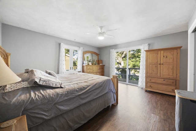 bedroom with multiple windows, dark hardwood / wood-style floors, ceiling fan, and access to exterior