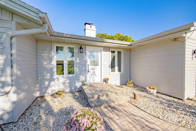 doorway to property with a patio