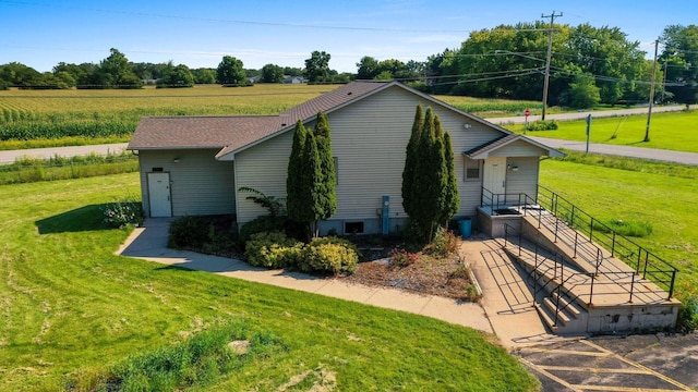 view of property exterior with a yard