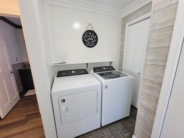 clothes washing area with crown molding and washing machine and dryer