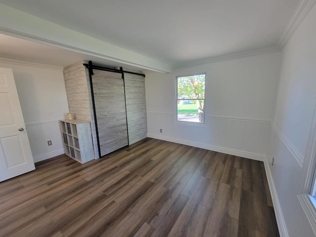 unfurnished bedroom featuring dark wood-type flooring and ornamental molding