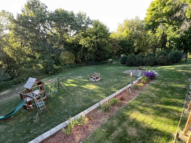 36997 Wildernest Rd, Prairie Du Chien, WI 53821 - view of yard with a fire pit and a playground