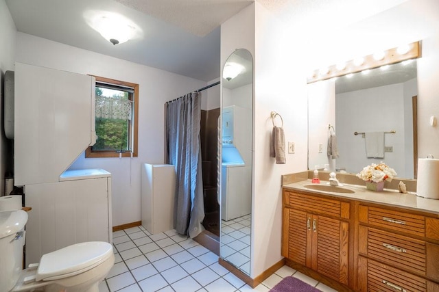 bathroom featuring tile patterned flooring, a shower with curtain, vanity, and toilet