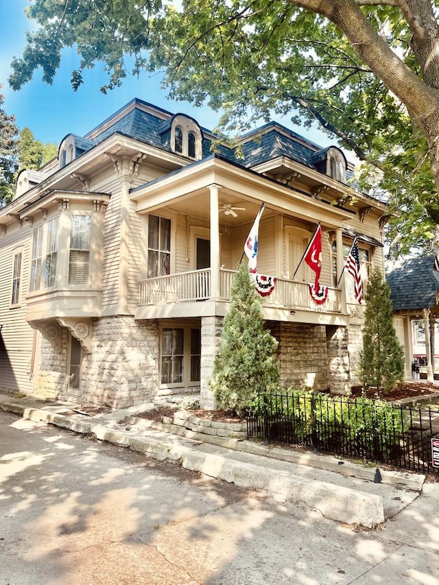 view of front of house with a balcony