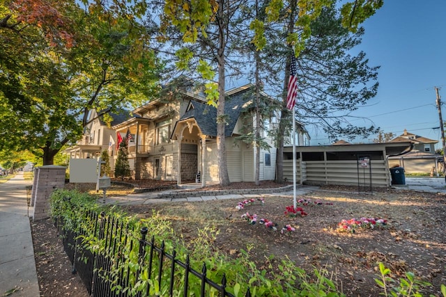 view of front of property featuring a carport