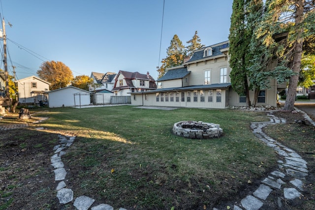 view of yard with an outdoor fire pit