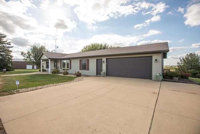 ranch-style home with a front yard and a garage