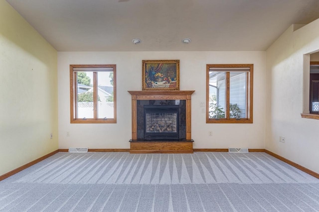 unfurnished living room featuring carpet floors