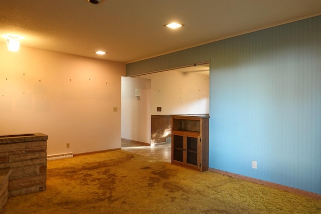 carpeted spare room with crown molding