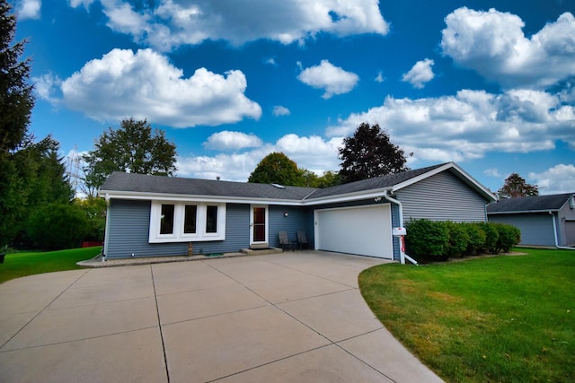 single story home featuring a garage and a front lawn