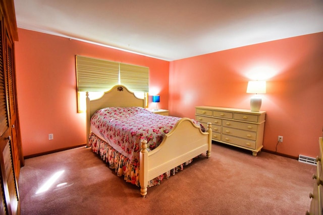 bedroom featuring light carpet and a closet