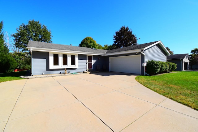 ranch-style house with a front yard and a garage