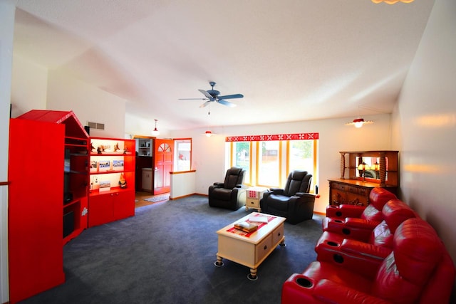 living room featuring vaulted ceiling, dark colored carpet, and ceiling fan