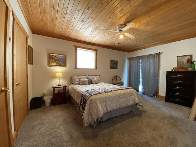 carpeted bedroom featuring ceiling fan, wood ceiling, and crown molding