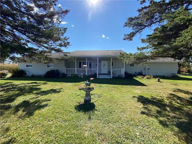 single story home with a porch and a front lawn