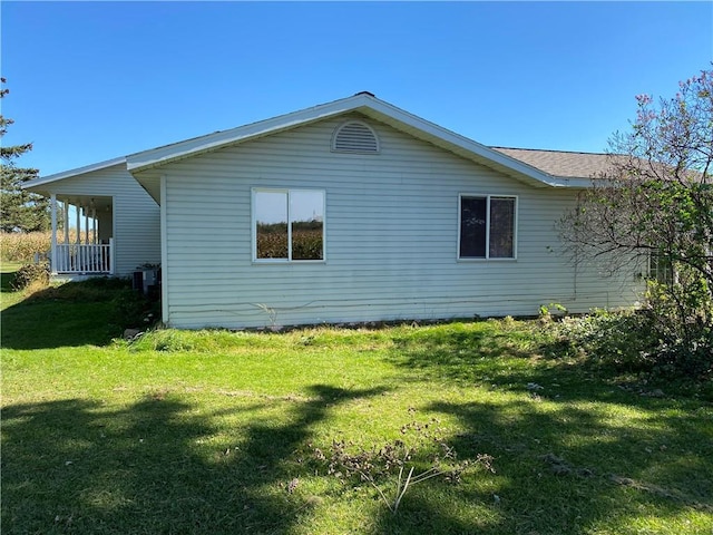 view of home's exterior with a yard