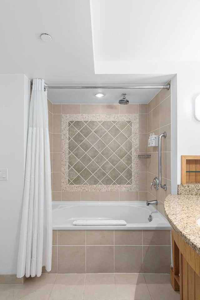 bathroom with shower / bath combo, tile patterned flooring, and vanity