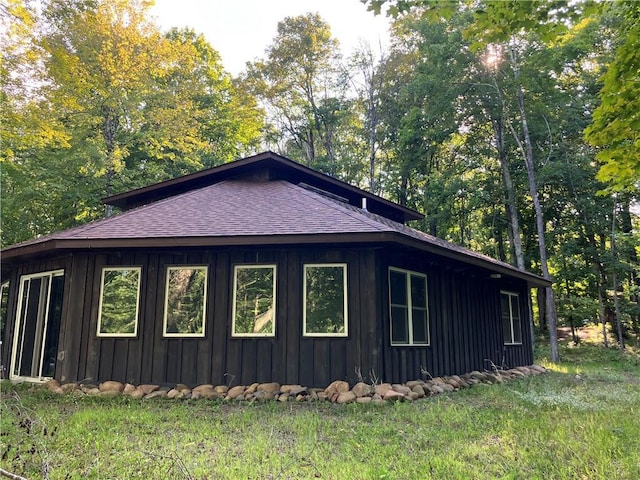 view of home's exterior with a yard