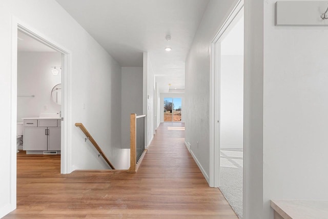 corridor featuring light hardwood / wood-style flooring