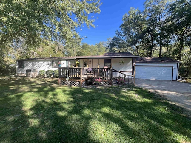 view of front of home with a deck and a front lawn