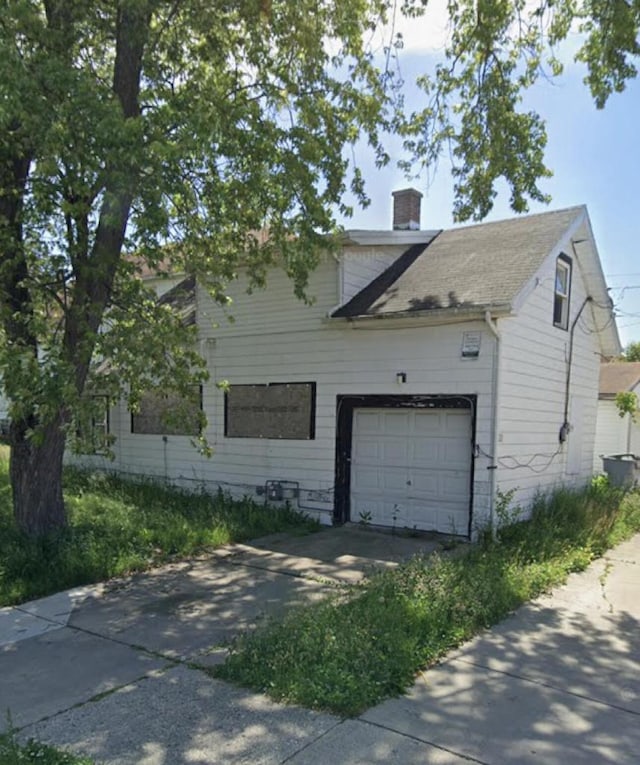 view of side of property featuring a garage