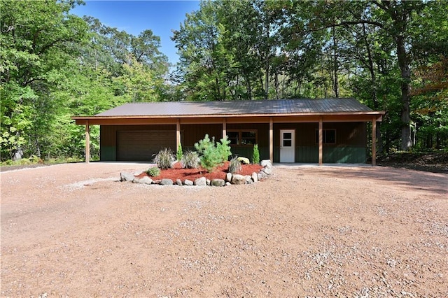 single story home with a carport and a garage