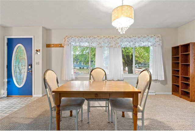 carpeted dining space with a textured ceiling