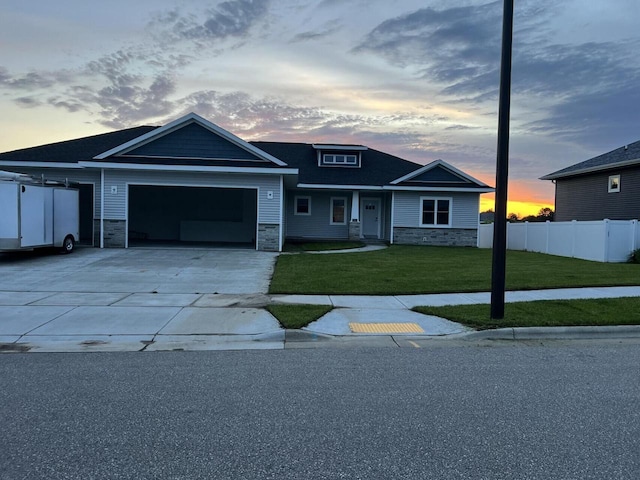 view of front facade featuring a yard and a garage