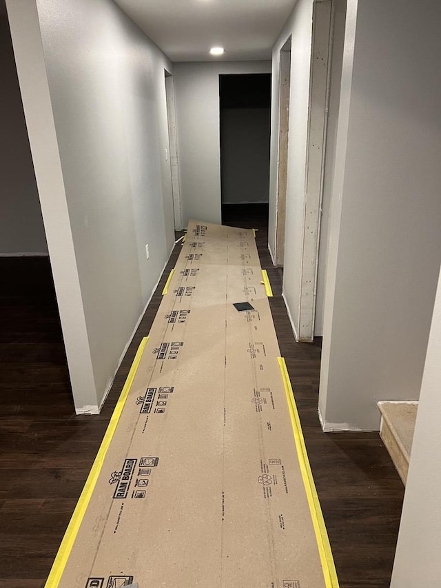 corridor with dark hardwood / wood-style floors