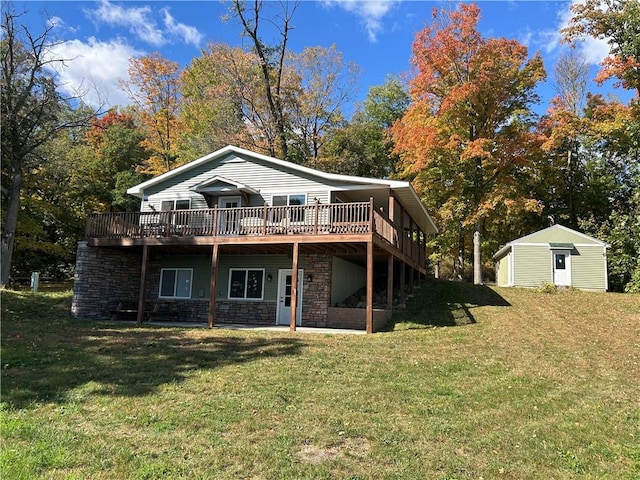 back of house with a wooden deck, a storage unit, and a lawn