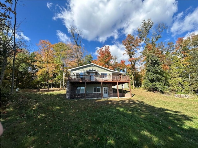 back of house featuring a yard and a deck