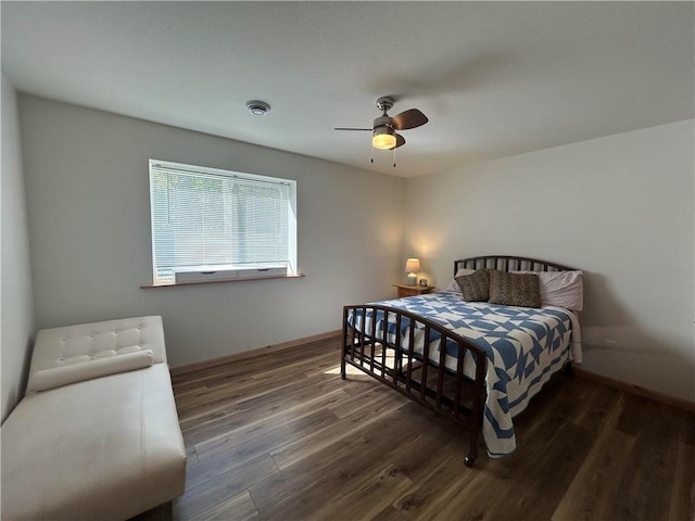 bedroom featuring ceiling fan and dark hardwood / wood-style flooring