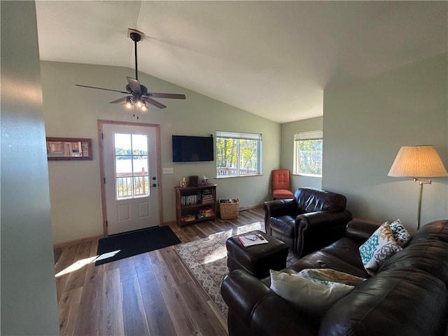 living room with vaulted ceiling, ceiling fan, and hardwood / wood-style flooring