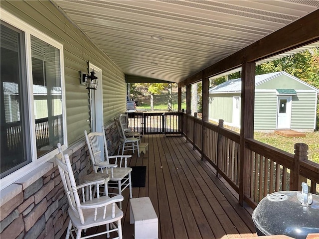 deck with a storage shed