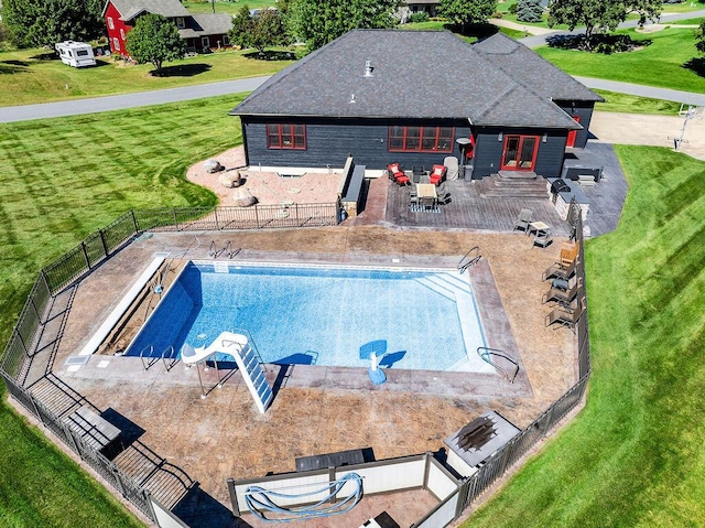 view of pool featuring a yard and a patio area