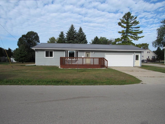 ranch-style house with a deck, a garage, and a front yard