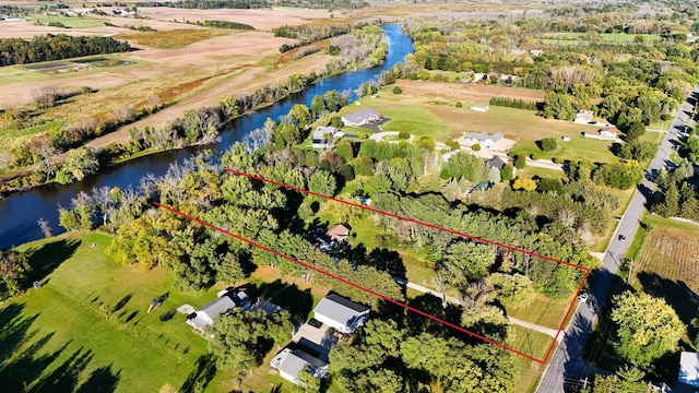 bird's eye view featuring a water view and a rural view