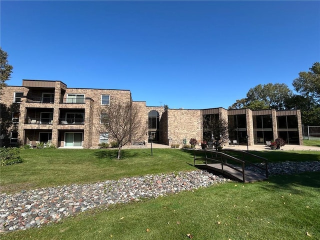 view of home's community featuring a lawn