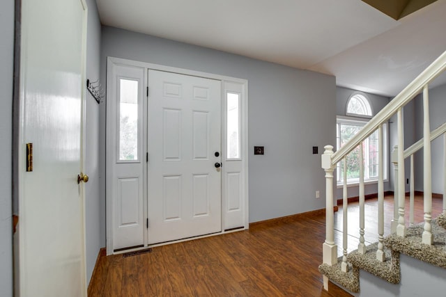 foyer with plenty of natural light and dark hardwood / wood-style floors