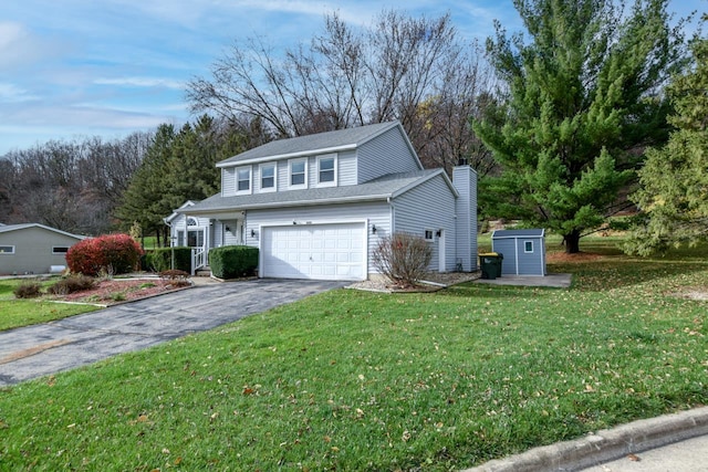 view of property with a front lawn, a storage unit, and a garage