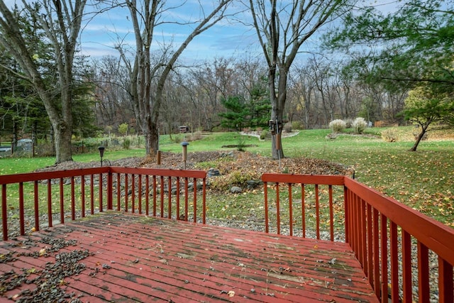 wooden deck with a lawn