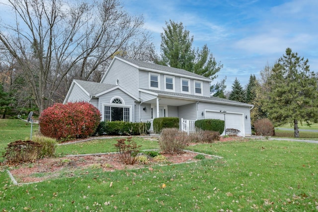 view of front property with a garage and a front lawn