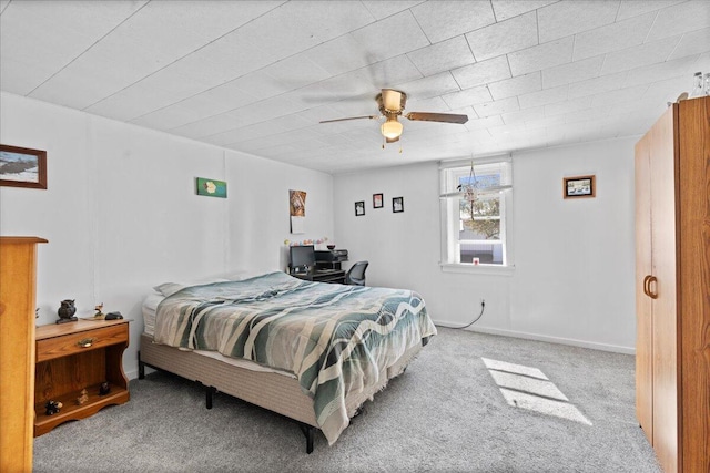 bedroom with ceiling fan and carpet floors