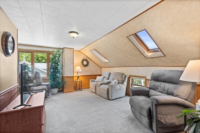 interior space with lofted ceiling with skylight and wooden walls