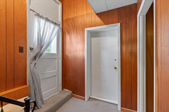 interior space featuring wooden walls