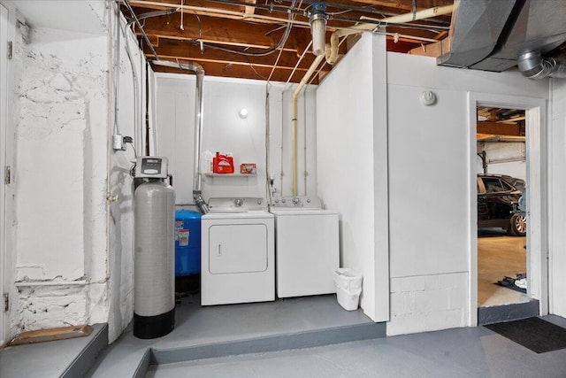 clothes washing area featuring washing machine and clothes dryer