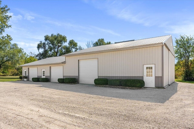 garage featuring wood walls