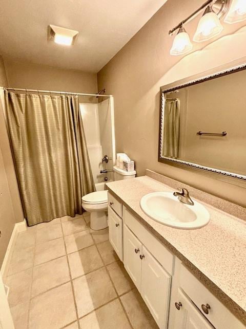 full bathroom with tile patterned flooring, vanity, toilet, and shower / tub combo with curtain