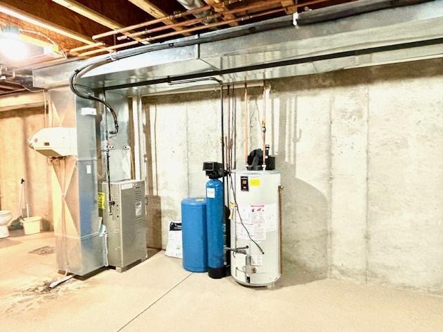 basement with heating unit and gas water heater