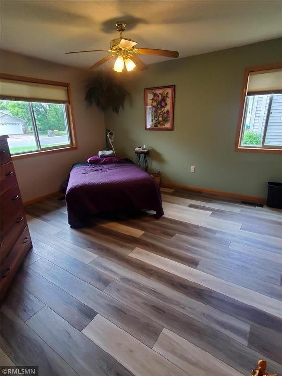 bedroom featuring ceiling fan and light hardwood / wood-style floors